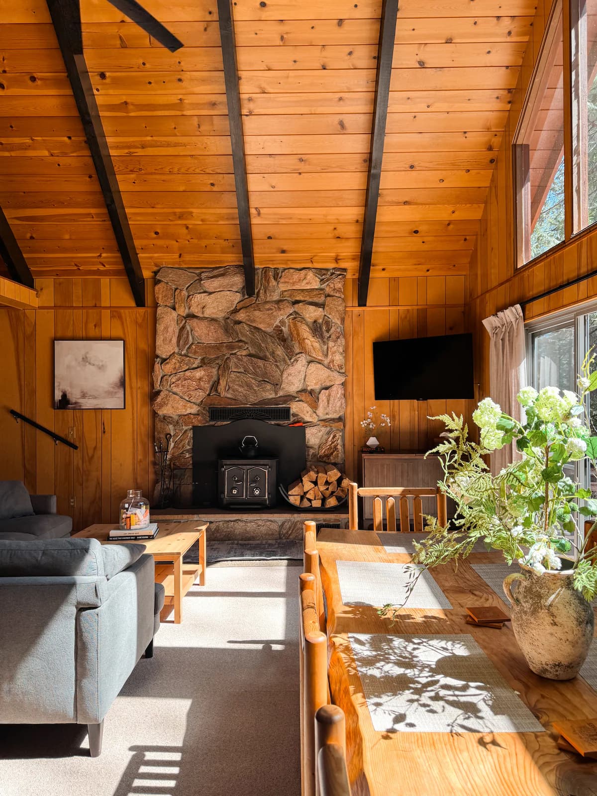 Make yourself at home in our cozy living area with large chalet windows, all with a view of the forest of course.